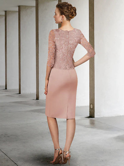 Woman wearing a half-sleeve lace Mother of the Bride dress, showing side profile and back detail.