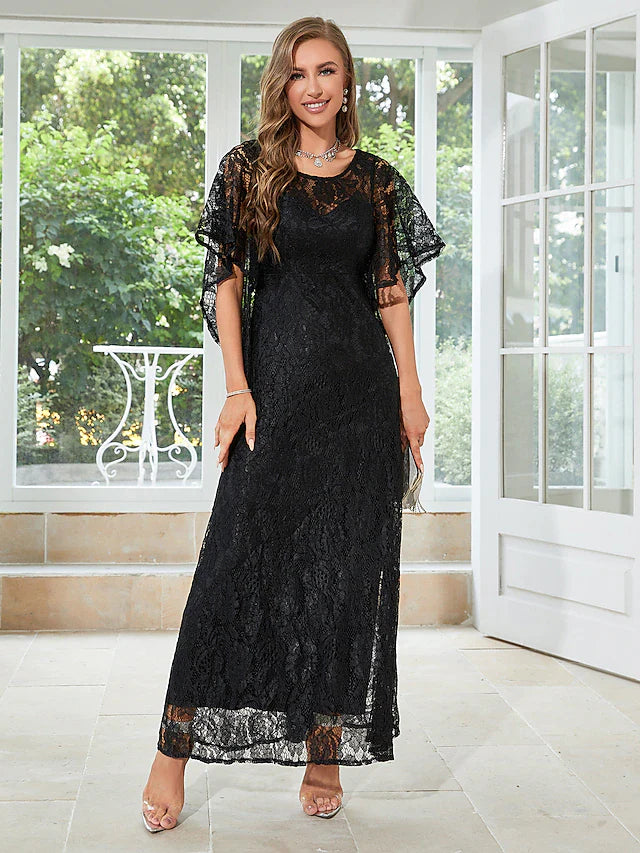 Woman in elegant A-line half-sleeve dress with lace and ruffles.