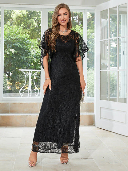 Woman in elegant A-line half-sleeve dress with lace and ruffles.
