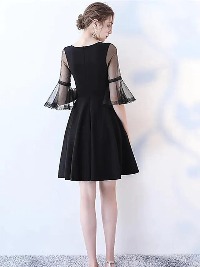 Back view of the navy A-line jewel neck half sleeve pleated tulle knee-length dress.