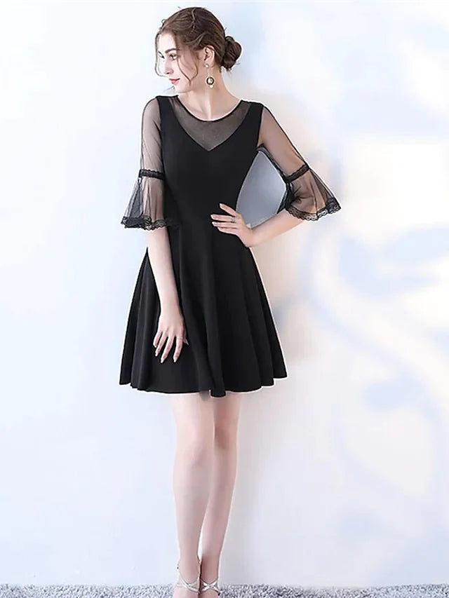 Side view of the elegant navy A-line jewel neck half sleeve pleated tulle cocktail dress.