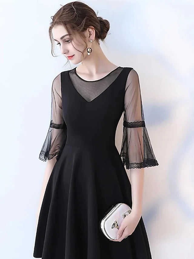 Close-up of the pleated tulle fabric on the knee-length cocktail dress.
