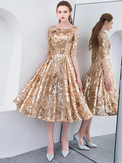 Model wearing an elegant A-line sequined tea-length cocktail dress with a jewel neck and half sleeves.