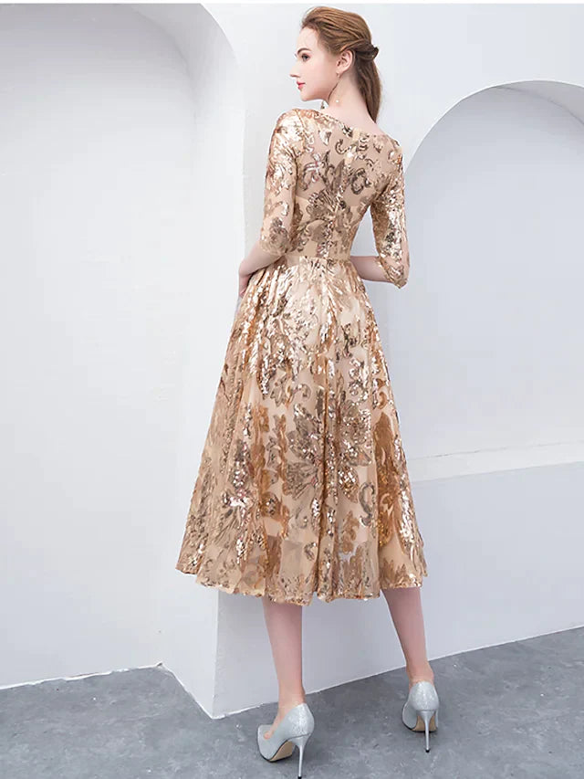 Woman posing in a shimmering sequined A-line cocktail dress, showcasing its tea length.