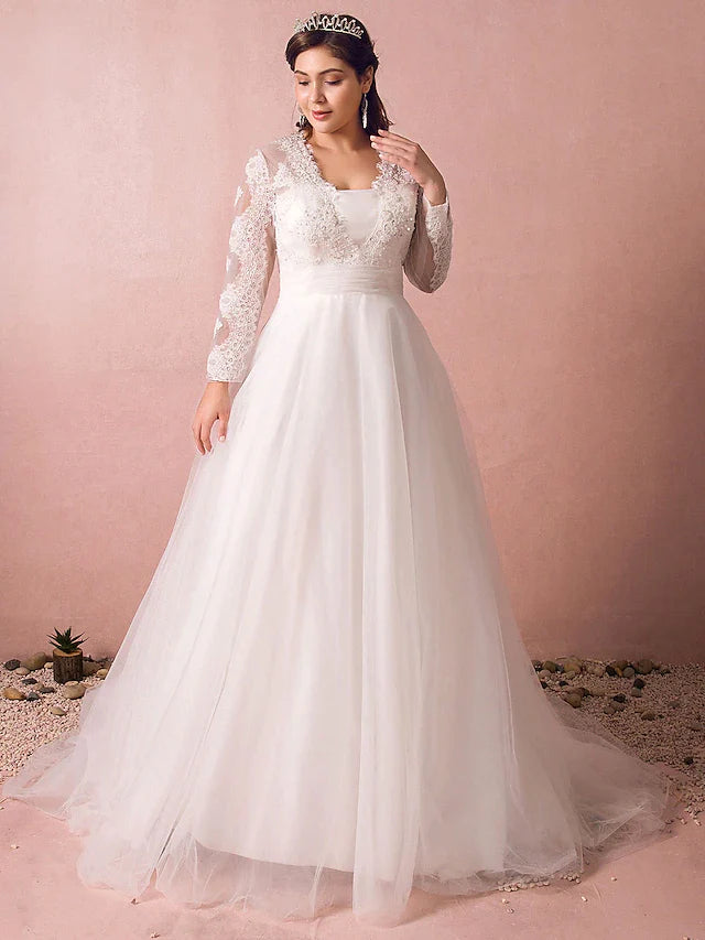 Side profile of a bride wearing the A-line wedding dress with a flowing skirt.