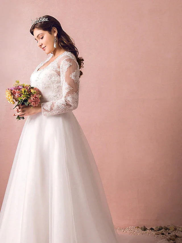 Full length view of the A-line wedding gown with a graceful silhouette.