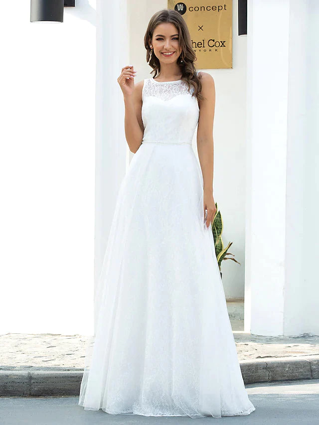 Model wearing an A-line jewel neck lace tulle wedding dress, front view.