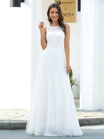 Model wearing an A-line jewel neck lace tulle wedding dress, front view.