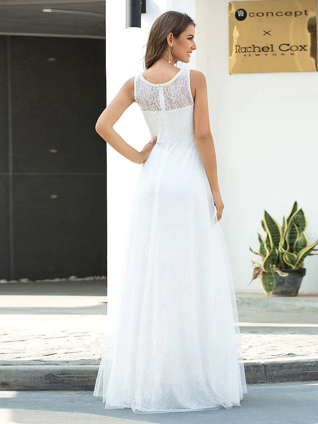 Model wearing an A-line jewel neck lace tulle wedding dress, side view.