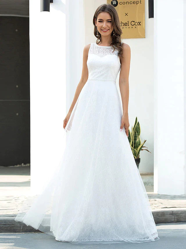 Back view of an A-line jewel neck lace tulle wedding dress with a flowing train.