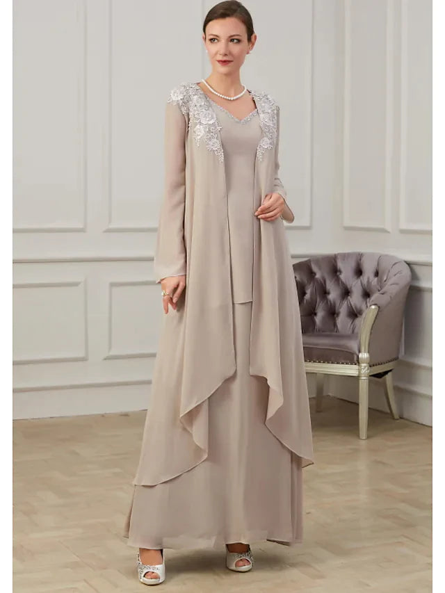Close-up of the jewel neck and long sleeve details on the Mother of the Bride dress.