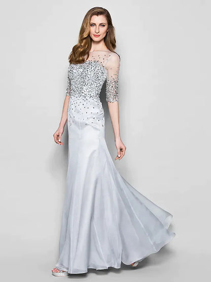 Detail of the intricate beading and sequin embellishments on the dress bodice.