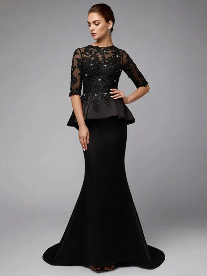 Back view of the elegant Mother of the Bride dress, showing lace details and satin fabric.