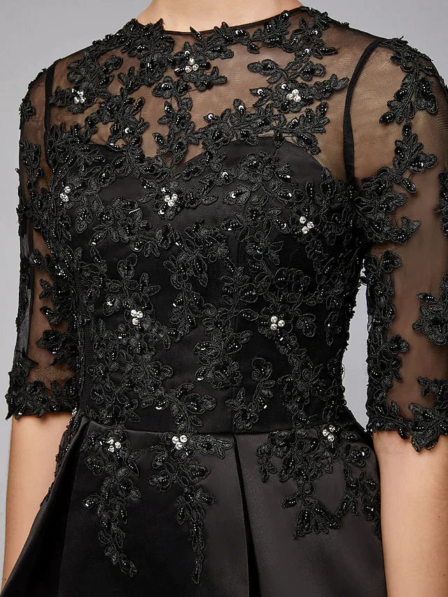 Close-up of the jewel neck and beaded lace bodice on the Mother of the Bride dress.