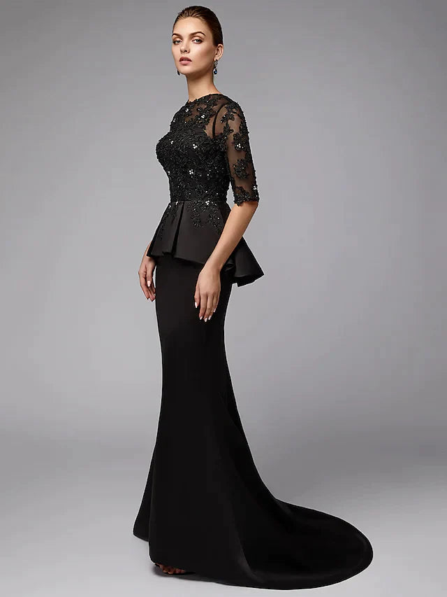 Close-up of the back of the Mother of the Bride dress, showing lace and zipper.