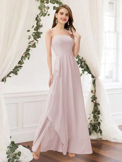 Woman wearing an elegant pink A-line chiffon bridesmaid dress with a jewel neck and pleated skirt.