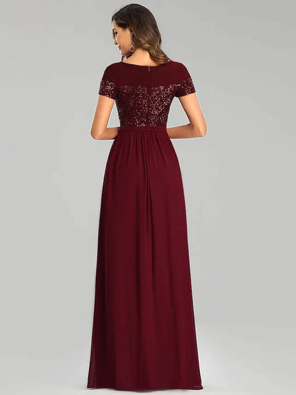 Close-up of the sparkling sequin bodice and jewel neckline of the bridesmaid dress.