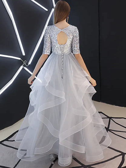Back view of the A-line jewel neck sequin tulle bridesmaid gown.