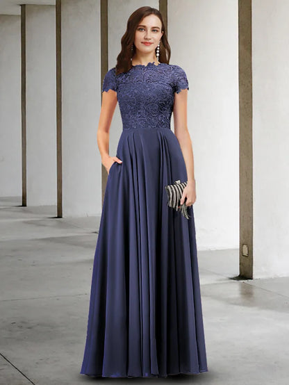 Woman wearing an elegant A-Line Mother of the Bride dress with jewel neck and short sleeves, front view.