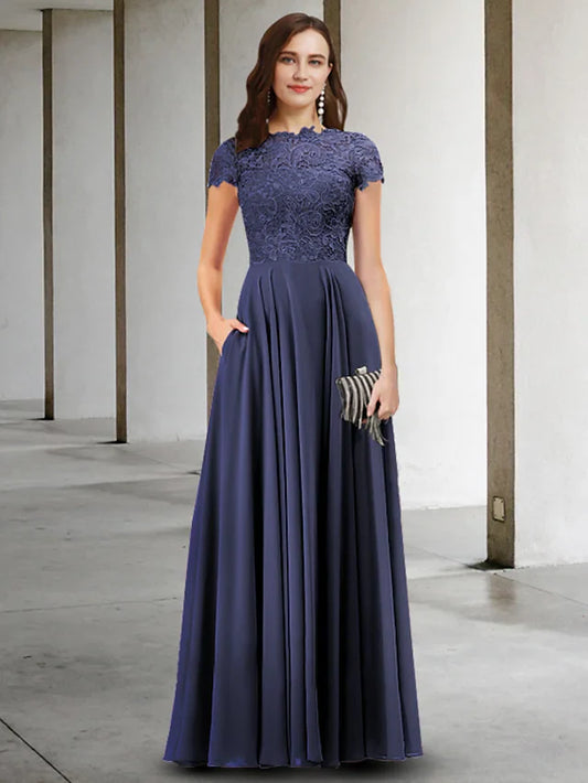 Woman wearing an elegant A-Line Mother of the Bride dress with jewel neck and short sleeves, front view.