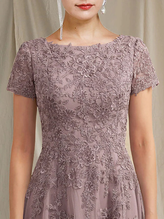 Close-up of delicate lace and applique details on the dress bodice.