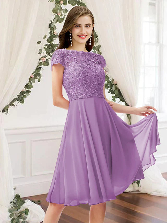 Model wearing an elegant A-line jewel neck knee-length chiffon lace bridesmaid dress with pleats.