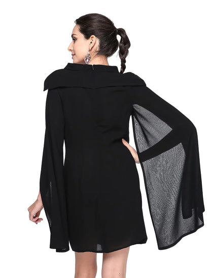 Close-up of the black chiffon fabric and jewel neckline of the dress.