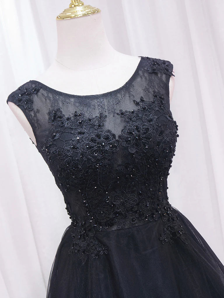 Back view of black A-line high-low dress.