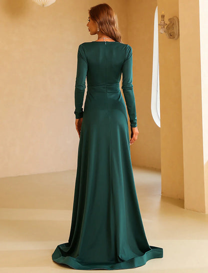 Side view of the A-line evening gown, showing the long sleeves and sweep train.