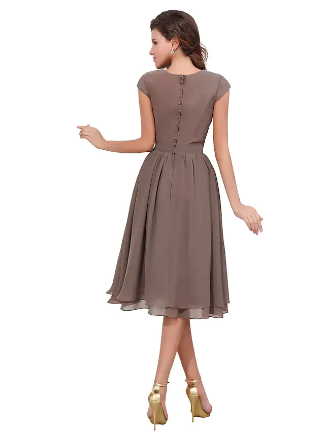 Side view of the A-line chiffon dress, highlighting the knee-length hem and sleeve detail.