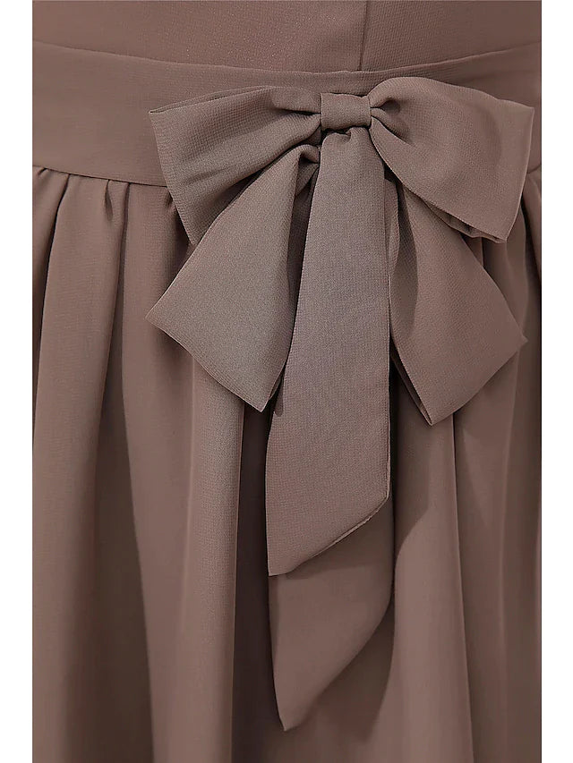 Detail shot of the button embellishments on the A-line mother of the bride dress.
