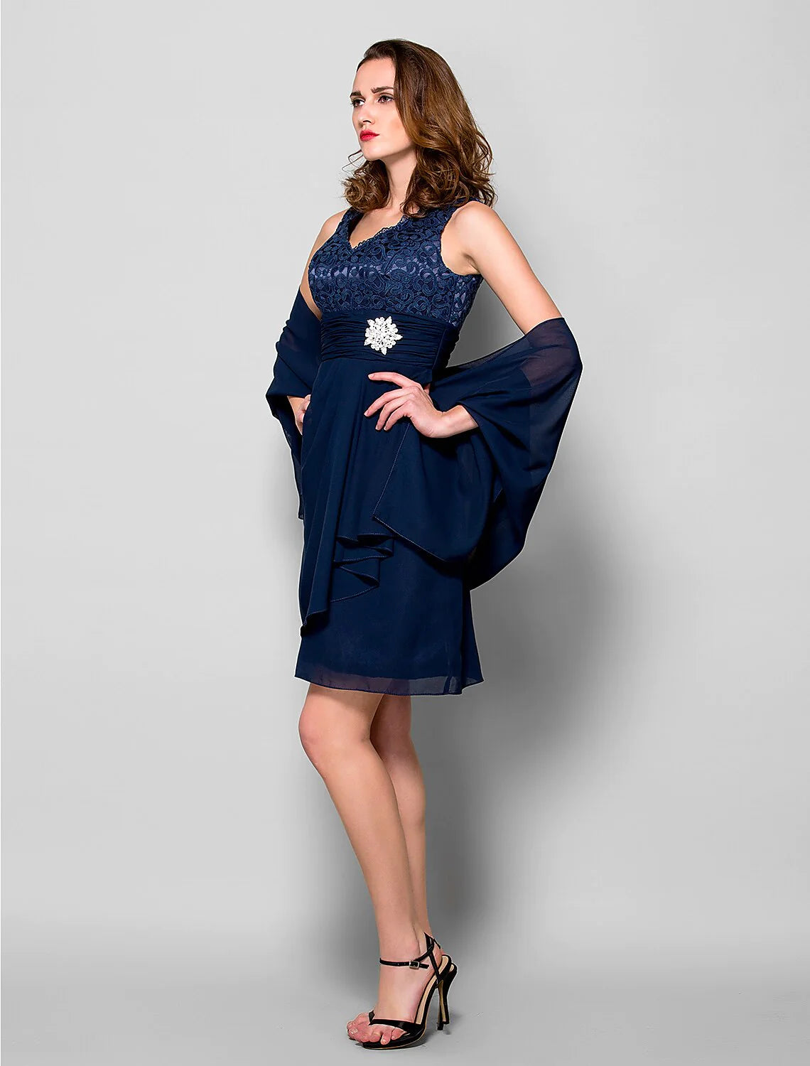 Back view of the light blue A-line mother of the bride dress, showing the elegant wrap.