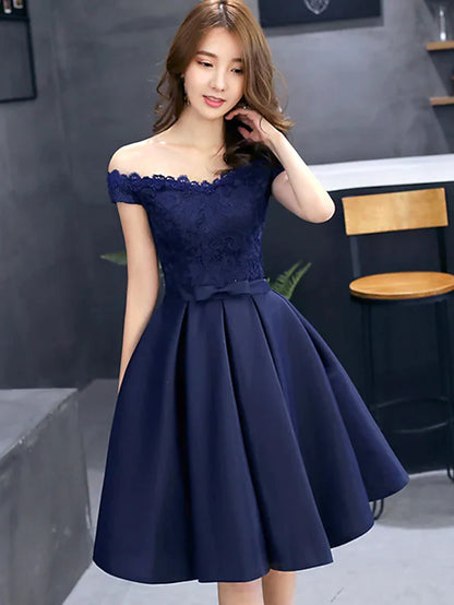 Model wearing an elegant A-line floral lace off-shoulder mini dress.