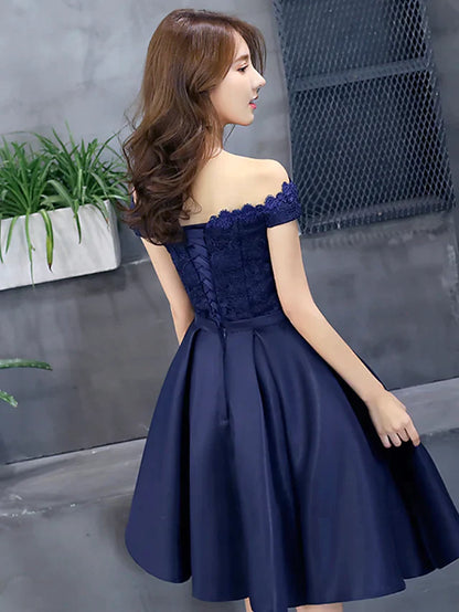 Back view of the A-line floral lace off-shoulder mini dress with pleats.