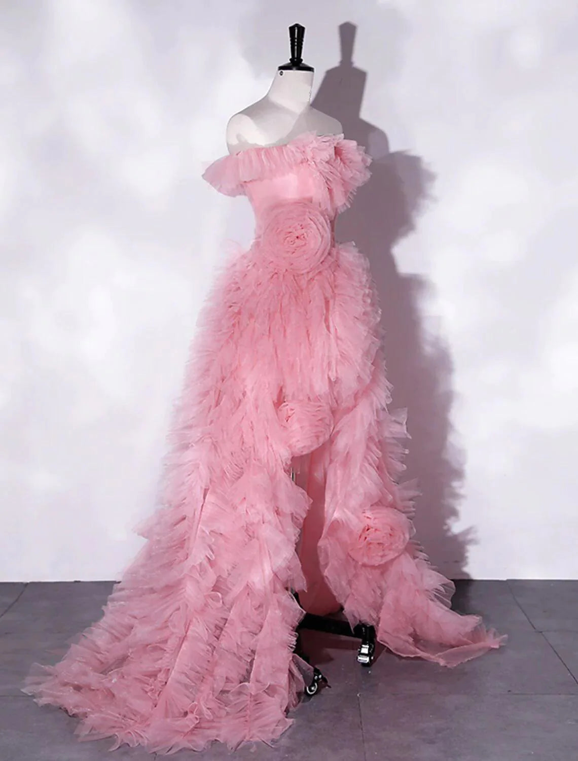 Close-up of the floral details and tulle fabric on an A-line off-shoulder dress.