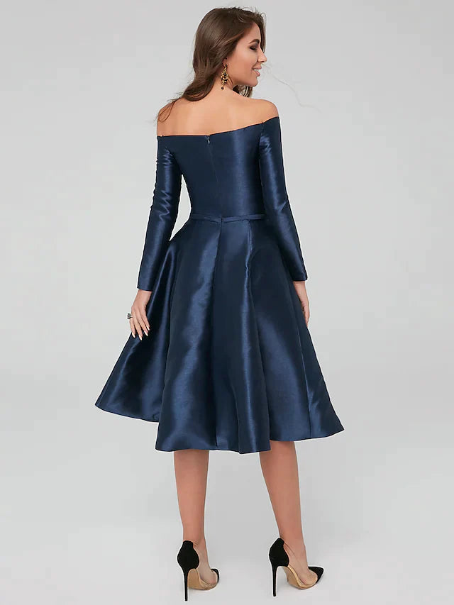 Side view of a woman in a sophisticated off-shoulder satin dress, highlighting the A-line silhouette.