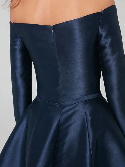 Back view of the pleated A-line satin dress with long sleeves, suitable for special occasions.