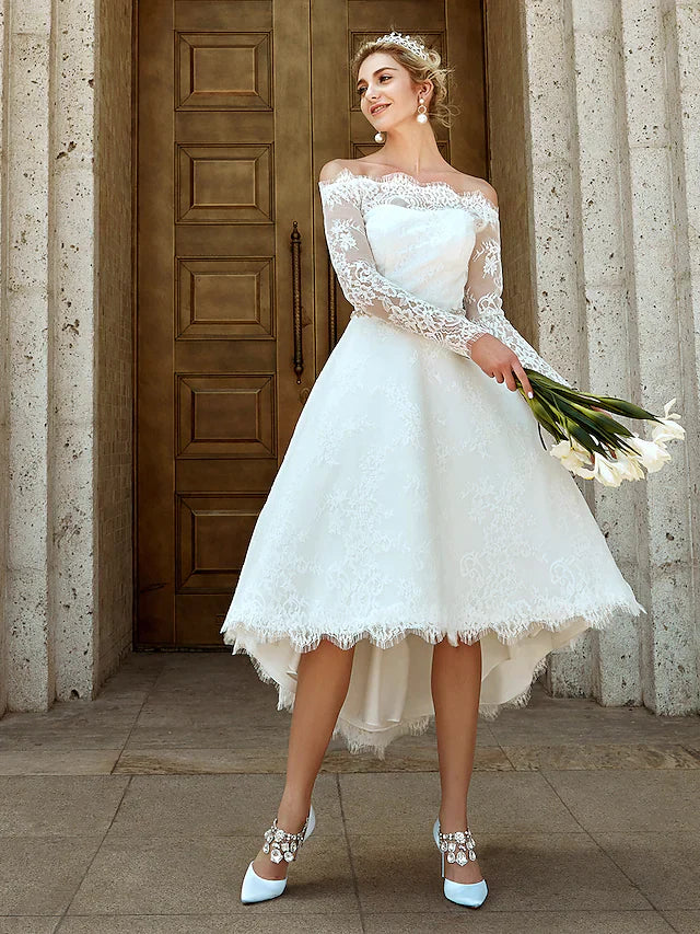 Back view of the A-line wedding dress, showing the train and lace details.