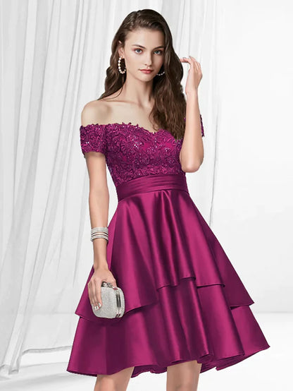 Model wearing an elegant A-line off-shoulder satin knee-length dress with pleats.