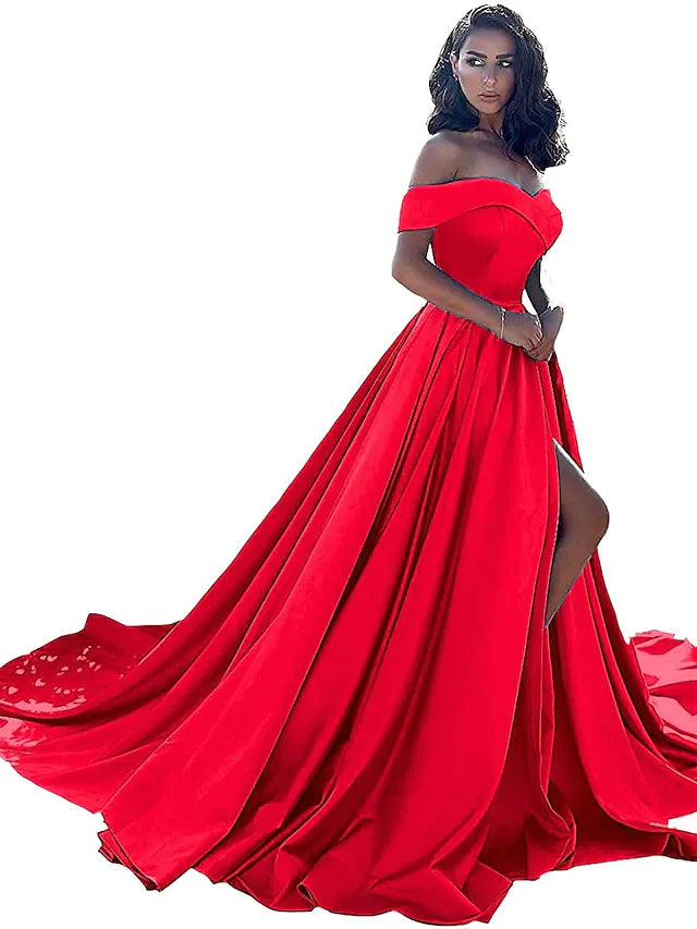 Model posing in a red A-line off-shoulder satin dress, showing the side split.
