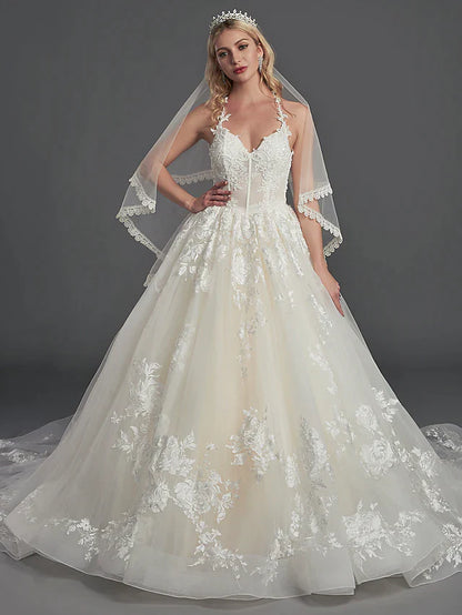 Bride wearing an elegant A-line off-shoulder satin wedding dress with short sleeves and cascading ruffles.