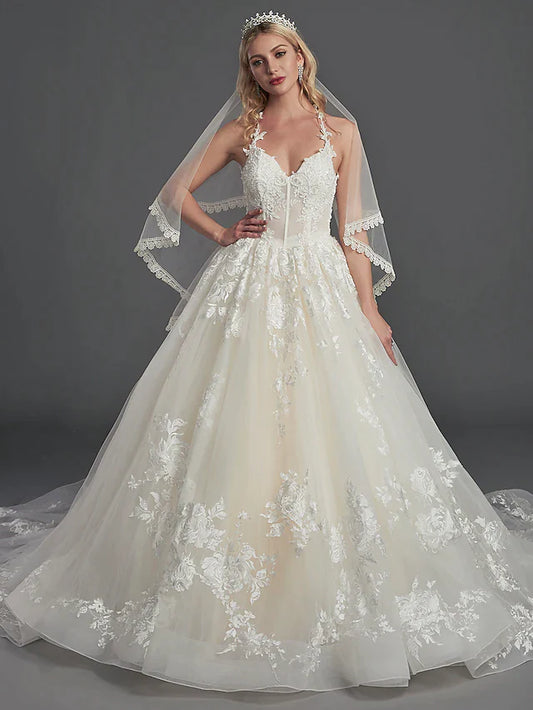 Bride wearing an elegant A-line off-shoulder satin wedding dress with short sleeves and cascading ruffles.