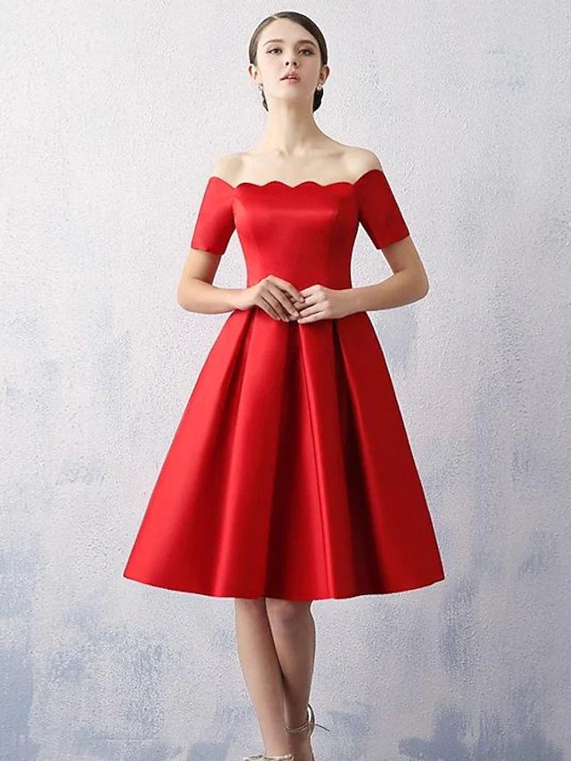 Woman wearing an elegant A-line off-shoulder satin cocktail dress.