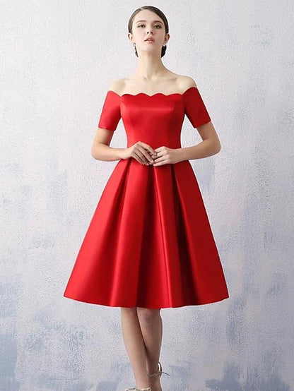 Woman wearing an elegant A-line off-shoulder satin cocktail dress.
