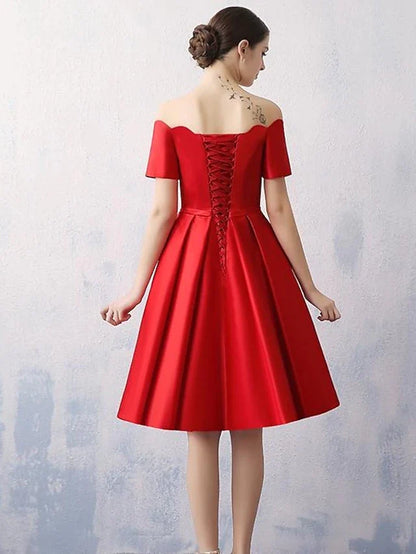Back view of an A-line off-shoulder satin dress, knee-length.
