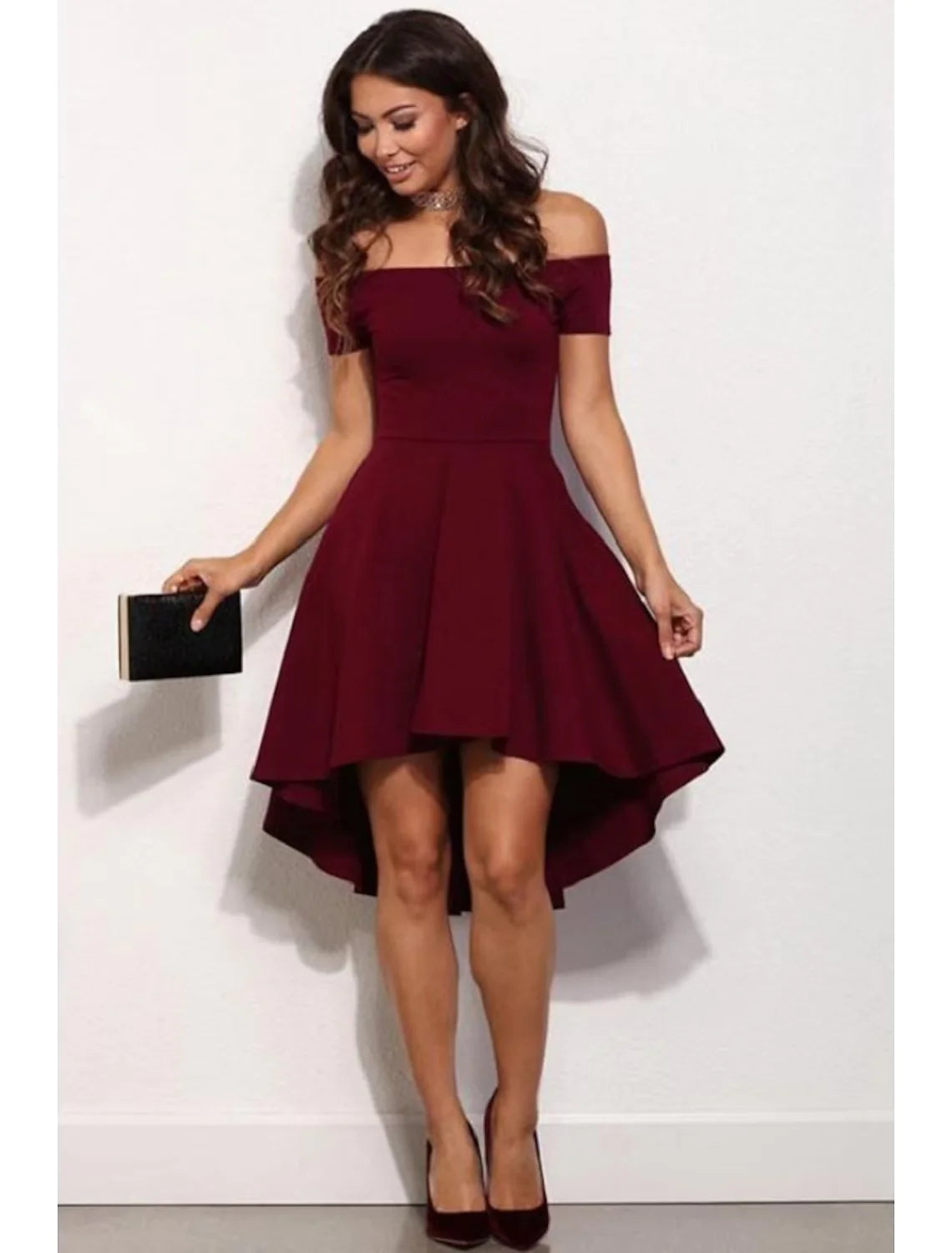 Woman wearing an A-line off-shoulder short sleeve satin mini dress.