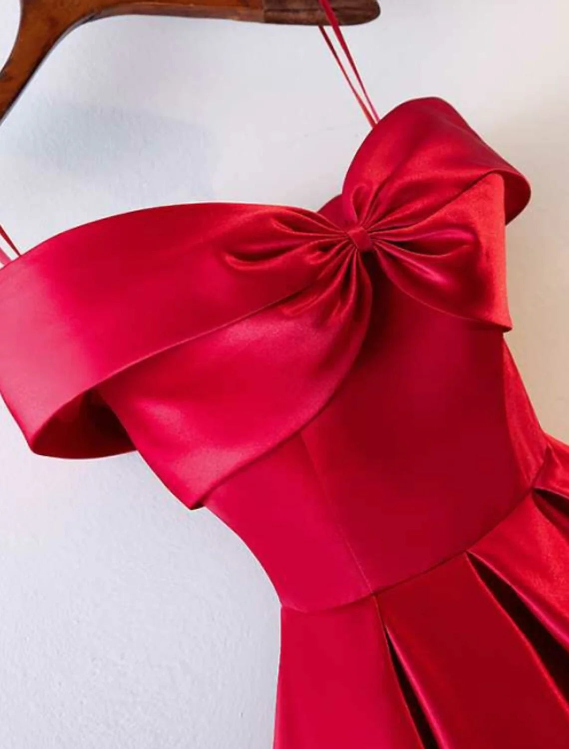Back view of the elegant satin gown, showcasing the open back design.