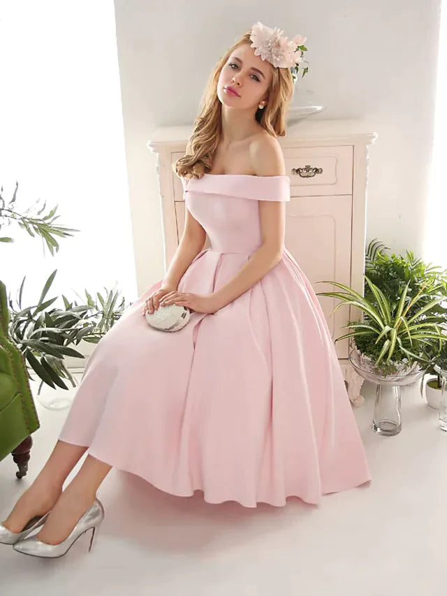 Side view of a woman in an A-line off-shoulder vintage party dress.