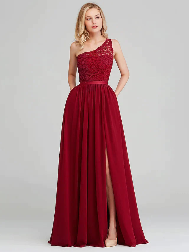 Detail of the delicate chiffon fabric and satin sash ribbon on the dress.