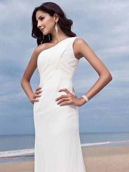 Detail of the flowing chiffon skirt and delicate side draping on the wedding dress.